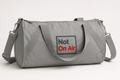 Gray Not On Air barrel duffel bag with a dark gray and red embroidered logo on the front panel.
